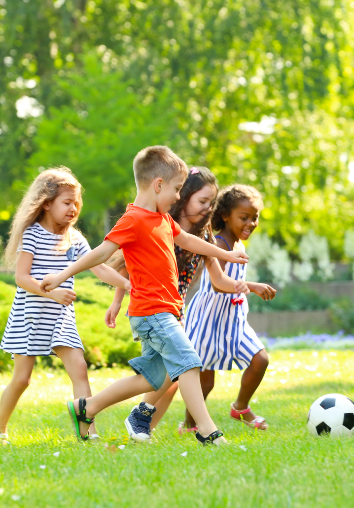 kids playng football outdoors